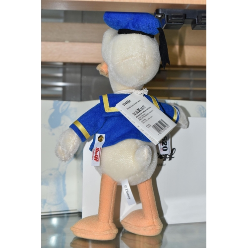 620 - A BOXED STEIFF LIMITED EDITION 'DONALD DUCK', made from mohair and cotton, gold coloured button and ... 