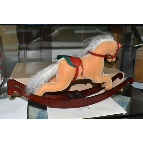 636 - A BOXED STEIFF LIMITED EDITION ROCKING HORSE, with beige mohair covering, red leather saddle and a w... 