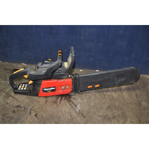 1065 - A HOMELITE HCS3335 PETROL CHAINSAW with 14in blade and cover (engine starts and runs)