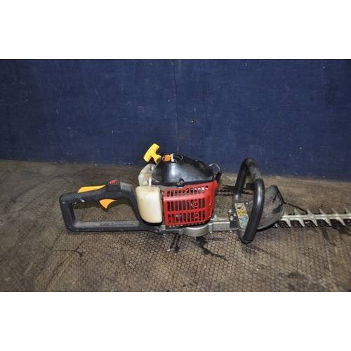 1067 - A HOMELITE HHT2660 PETROL HEDGE TRIMMER with 24in cut (engine pulls freely but hasn't started)