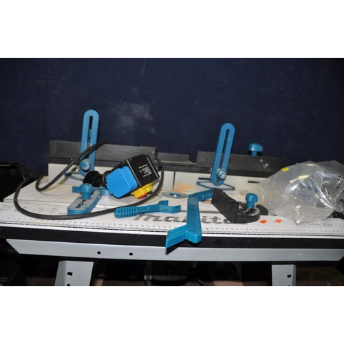 1120 - A MAKITA ROUTER TABLE 490 with accessories and manual with a Trend T11E 1/2in router fitted and case... 