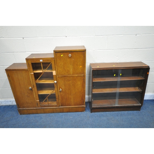 1199 - A MID CENTURY STEPPED BOOKCASE, fitted with two cupboard doors, one glazed door and a fall front doo... 