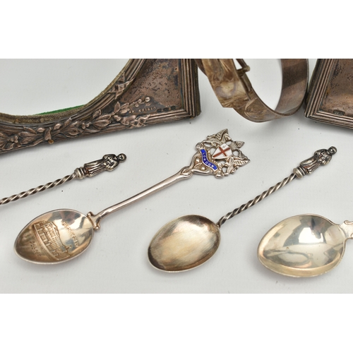 107 - TWO SILVER PHOTO FRAMES, A SILVER BANGLE AND TEASPOONS, two early 20th century silver photo frames, ... 