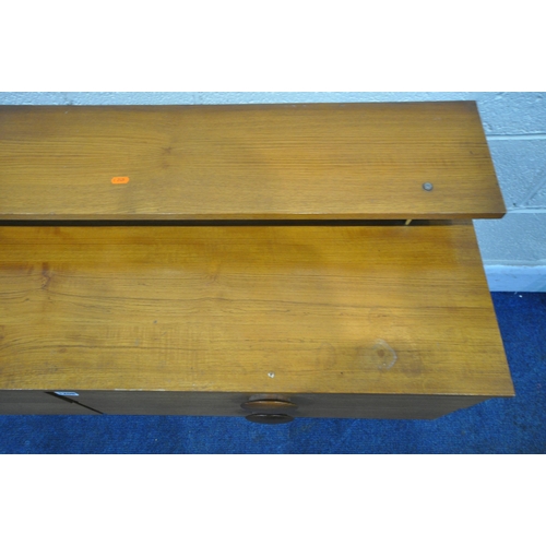 1208 - A MID CENTURY TEAK SIDEBOARD, with a raised shelf, fitted with four drawers, on cylindrical tapered ... 