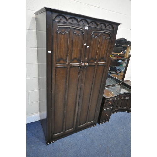 1230 - A 20TH CENTURY OAK TWO PIECE BEDROOM SUITE, comprising a double linenfold door wardrobe, width 96cm ... 