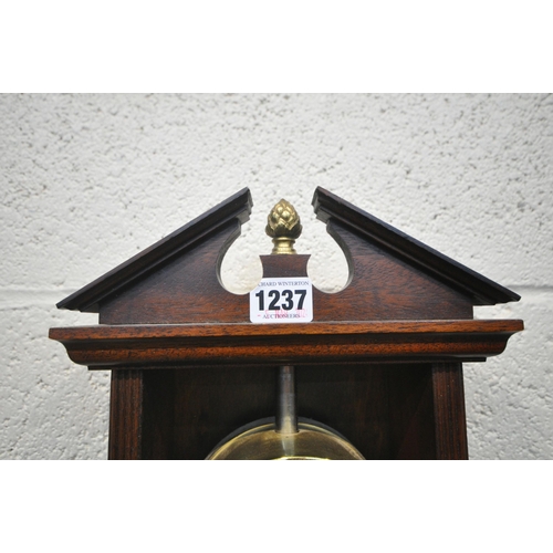 1237 - A REPRODUCTION MAHOGANY RACK CLOCK, with a break arch pediment, the enamel dial depicting Roman nume... 