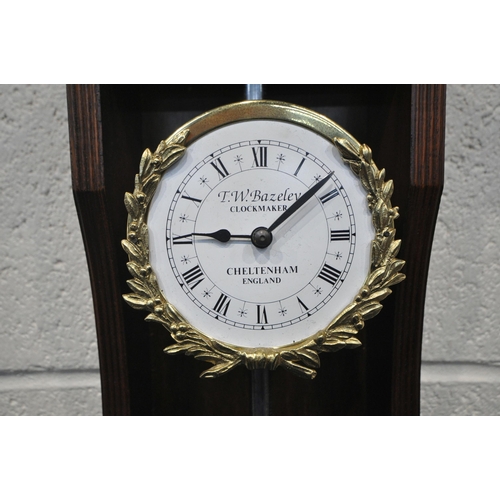 1237 - A REPRODUCTION MAHOGANY RACK CLOCK, with a break arch pediment, the enamel dial depicting Roman nume... 