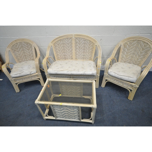 1334 - A FOUR PIECE WICKER CONSERVATORY SUITE, comprising a two seater sofa, a pair of armchairs and a coff... 