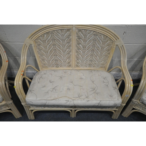 1334 - A FOUR PIECE WICKER CONSERVATORY SUITE, comprising a two seater sofa, a pair of armchairs and a coff... 