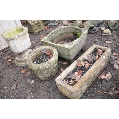 1019 - FOUR MODERN COMPOSITE GARDEN PLANTERS including an oblong  and a circular planter with brickwork pat... 