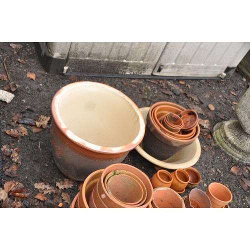 1021 - A COLLECTION OF TWO GLAZED PLANTERS AND A QUANTITY OF TERRACOTTA POTS of various sizes including a t... 