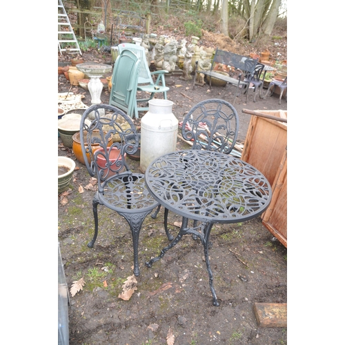 1030 - A MODERN CAST ALUMINIUM ROUND GARDEN TABLE AND TWO CHAIRS with pierced detail to seat and 60cm diame... 