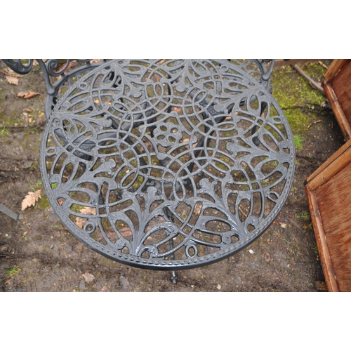 1030 - A MODERN CAST ALUMINIUM ROUND GARDEN TABLE AND TWO CHAIRS with pierced detail to seat and 60cm diame... 