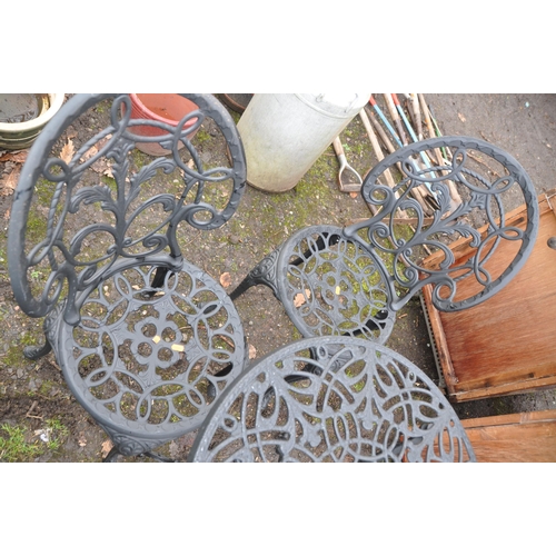 1030 - A MODERN CAST ALUMINIUM ROUND GARDEN TABLE AND TWO CHAIRS with pierced detail to seat and 60cm diame... 