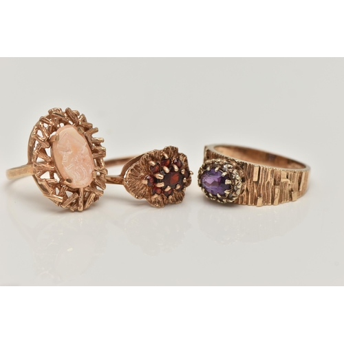 14 - THREE 9CT YELLOW GOLD GEM SET DRESS RINGS, to include a garnet cluster ring, an amethyst single ston... 