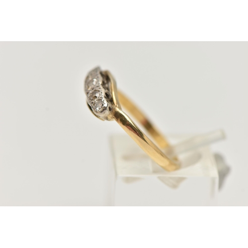 16 - A YELLOW METAL DIAMOND FIVE STONE RING, set with graduating single cut diamonds, to the plain polish... 