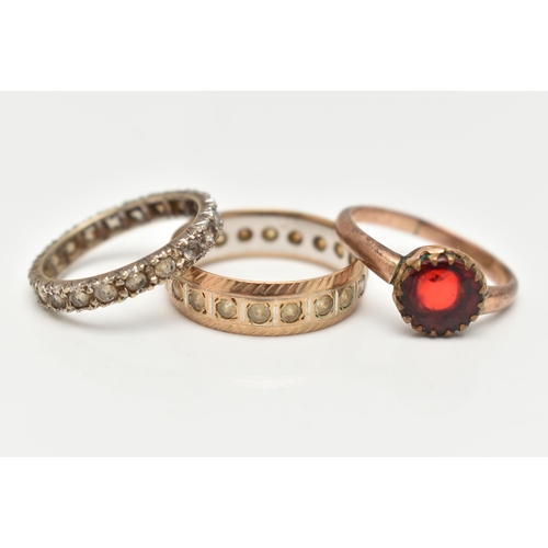 24 - THREE ASSORTED RINGS, to include a 9ct gold and spinel full set eternity band ring, approximate widt... 