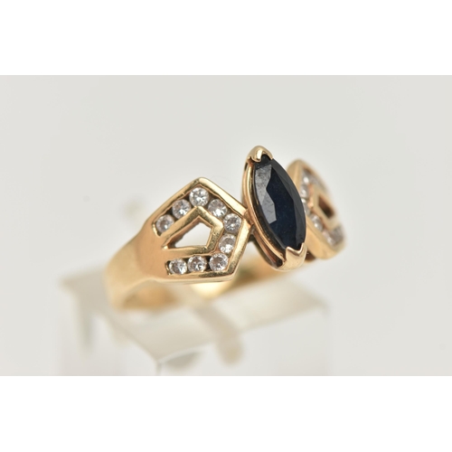 25 - A YELLOW METAL SAPPHIRE AND DIAMOND DRESS RING, centering on a marquise cut deep blue sapphire, to t... 