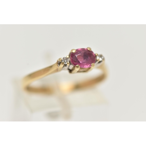 28 - A 9CT GOLD RUBY AND DIAMOND RING, designed as a central oval shape ruby flanked by single cut diamon... 