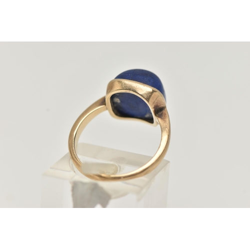 35 - A LAPIS LAZULI RING, designed as a square lapis lazuli cabochon in a collet setting to the plain ban... 