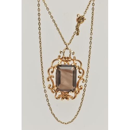 36 - A 9CT SMOKY QUARTZ PENDANT NECKLACE, the rectangular smoky quartz in a claw setting to the scrolling... 