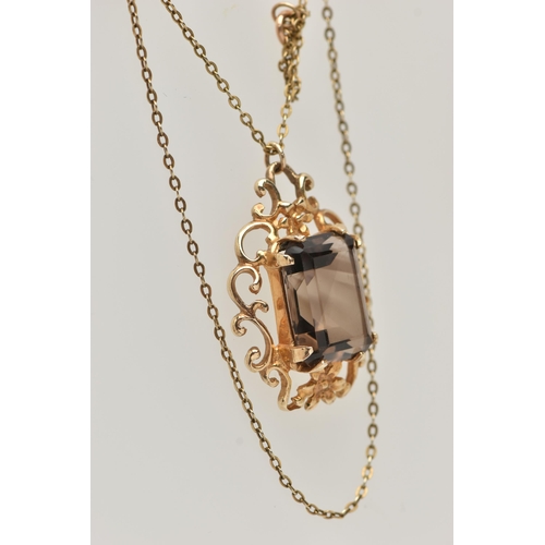 36 - A 9CT SMOKY QUARTZ PENDANT NECKLACE, the rectangular smoky quartz in a claw setting to the scrolling... 