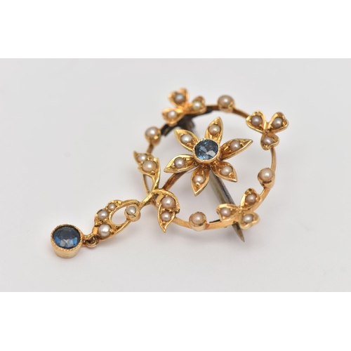 37 - AN EDWARDIAN SPLIT PEARL AND SAPPHIRE PENDANT, of circular outline with a central flower set with a ... 