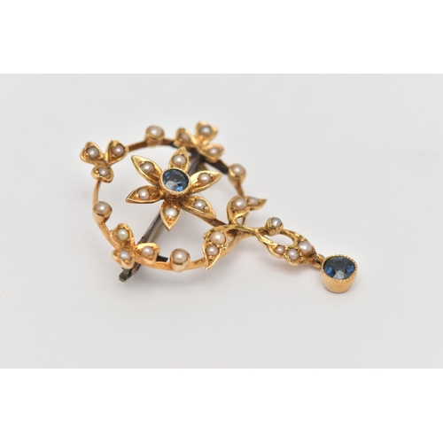 37 - AN EDWARDIAN SPLIT PEARL AND SAPPHIRE PENDANT, of circular outline with a central flower set with a ... 