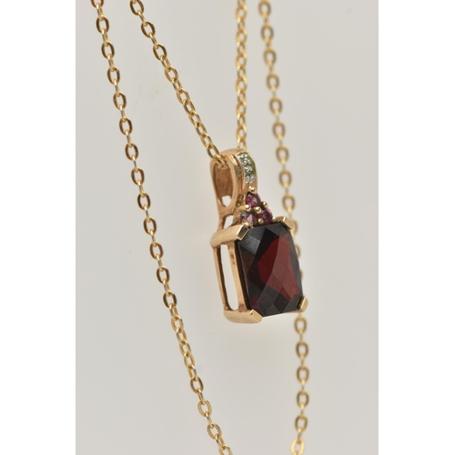 40 - A 9CT GOLD GARNET PENDANT, the rectangular faceted garnet in a four claw setting with further circul... 