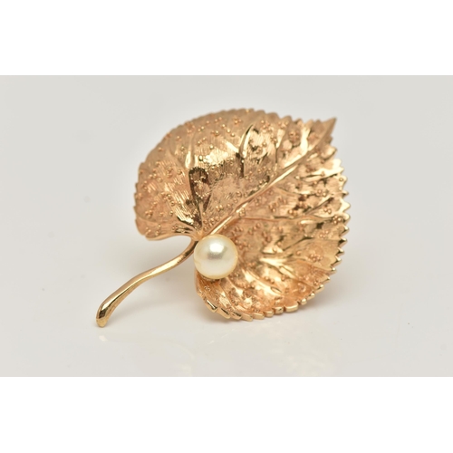 46 - A 'CHRISTIAN DIOR' LEAF BROOCH, set with an imitation pearl, fitted with a brooch pin and saftey cla... 