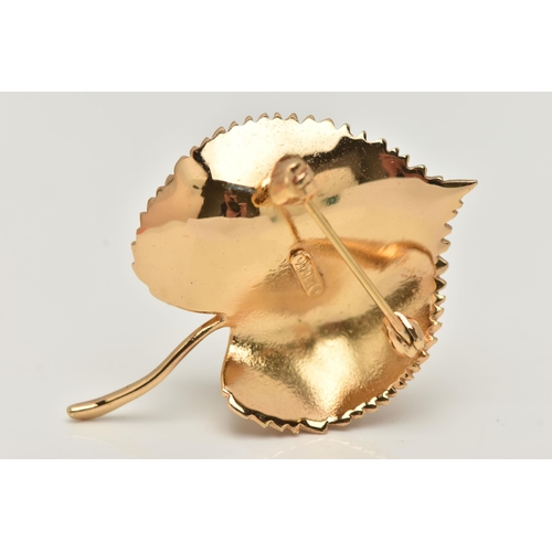 46 - A 'CHRISTIAN DIOR' LEAF BROOCH, set with an imitation pearl, fitted with a brooch pin and saftey cla... 