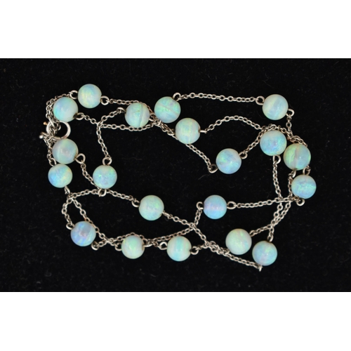 55 - A WHITE METAL OPAL BEAD NECKLACE, twenty opal beads each interspaced and fitted to a fine white meta... 