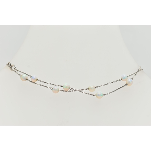 55 - A WHITE METAL OPAL BEAD NECKLACE, twenty opal beads each interspaced and fitted to a fine white meta... 