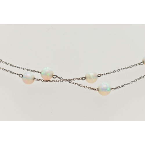 55 - A WHITE METAL OPAL BEAD NECKLACE, twenty opal beads each interspaced and fitted to a fine white meta... 