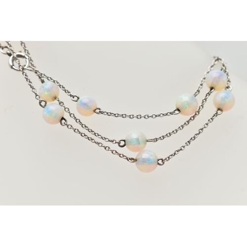 55 - A WHITE METAL OPAL BEAD NECKLACE, twenty opal beads each interspaced and fitted to a fine white meta... 