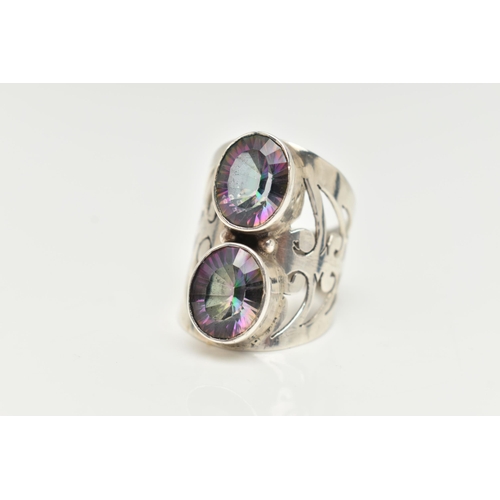 60 - A LARGE WHITE METAL MYSTIC QUARTZ DRESS RING, collet set with two oval cut mystic coated quartz, to ... 