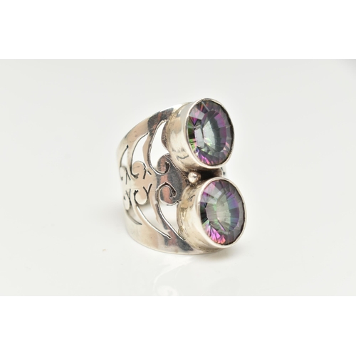 60 - A LARGE WHITE METAL MYSTIC QUARTZ DRESS RING, collet set with two oval cut mystic coated quartz, to ... 