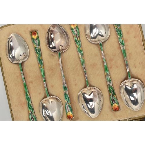 124 - A CASED SET OF SIX ENAMEL SILVER TEASPOONS, each decorated with a green enamel floral stem and flowe... 