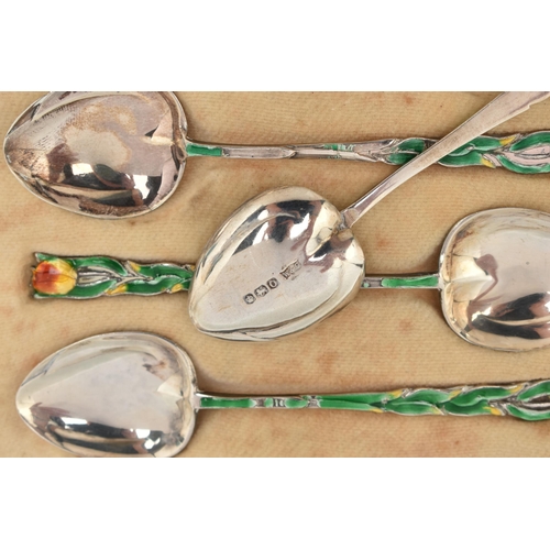 124 - A CASED SET OF SIX ENAMEL SILVER TEASPOONS, each decorated with a green enamel floral stem and flowe... 