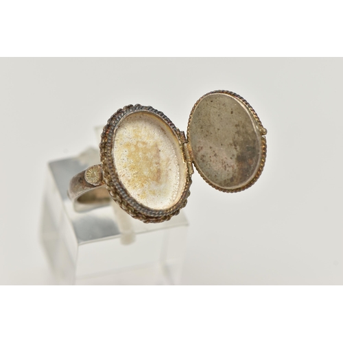 62 - A WHITE METAL RING, of an oval form, set with a cabcohon with bird detail, on a hinged cover, fine r... 