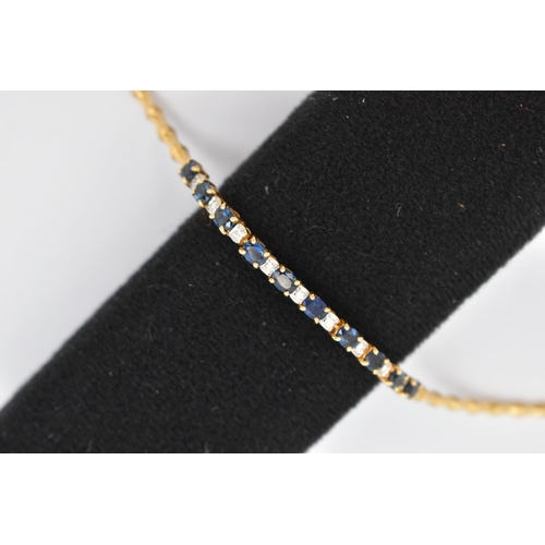 64 - A SAPPHIRE AND DIAMOND BRACELET, designed as a central section of ten oval cut sapphires interspaced... 