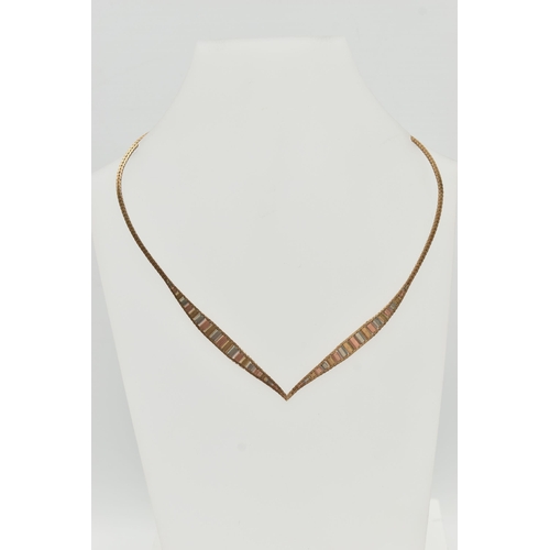 65 - A 9CT GOLD TRI-COLOUR NECKLACE, the tapered V-shape necklace with flattened herringbone chain, to th... 