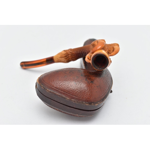 68 - AN AMBER AND MEERSCHAUM PIPE, in the form of an eagle talon gripping an amber chamber with amber mou... 