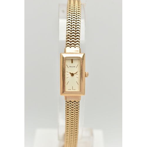 69 - A LADY'S 9CT GOLD ACCURIST WRISTWATCH, the rectangular cream face with gold colour baton markers and... 