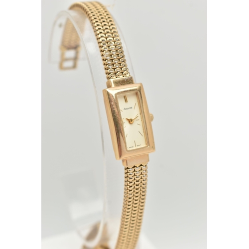 69 - A LADY'S 9CT GOLD ACCURIST WRISTWATCH, the rectangular cream face with gold colour baton markers and... 