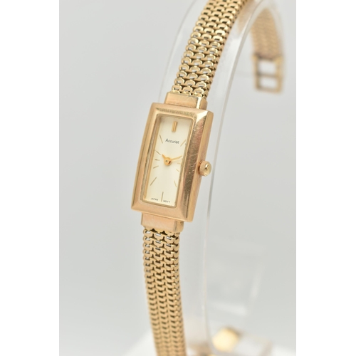 69 - A LADY'S 9CT GOLD ACCURIST WRISTWATCH, the rectangular cream face with gold colour baton markers and... 