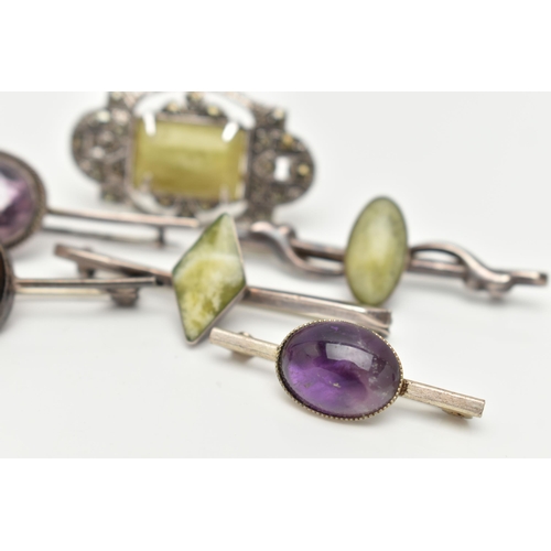 92 - SIX WHITE METAL BROOCHES, three set with green hardstones each stamped 'silver', an amethyst cabocho... 