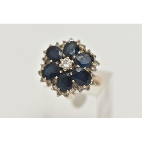 149 - A LARGE 18CT GOLD SAPPHIRE AND DIAMOND CLUSTER RING, six oval cut sapphires and a central round bril... 