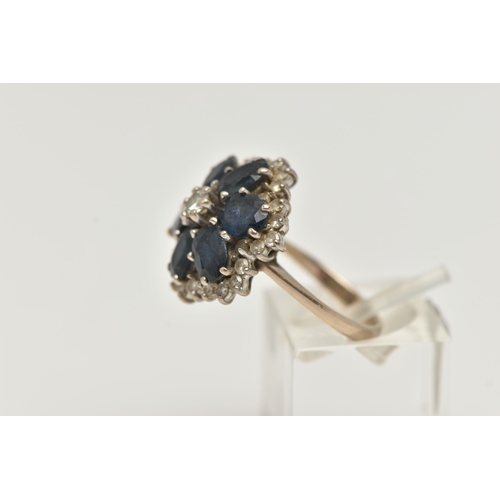 149 - A LARGE 18CT GOLD SAPPHIRE AND DIAMOND CLUSTER RING, six oval cut sapphires and a central round bril... 