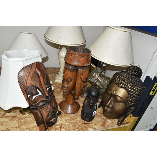 332 - A GROUP OF FOUR TABLE LAMPS AND CARVED WOOD FIGURES, comprising a cream onyx table lamp, a figural '... 